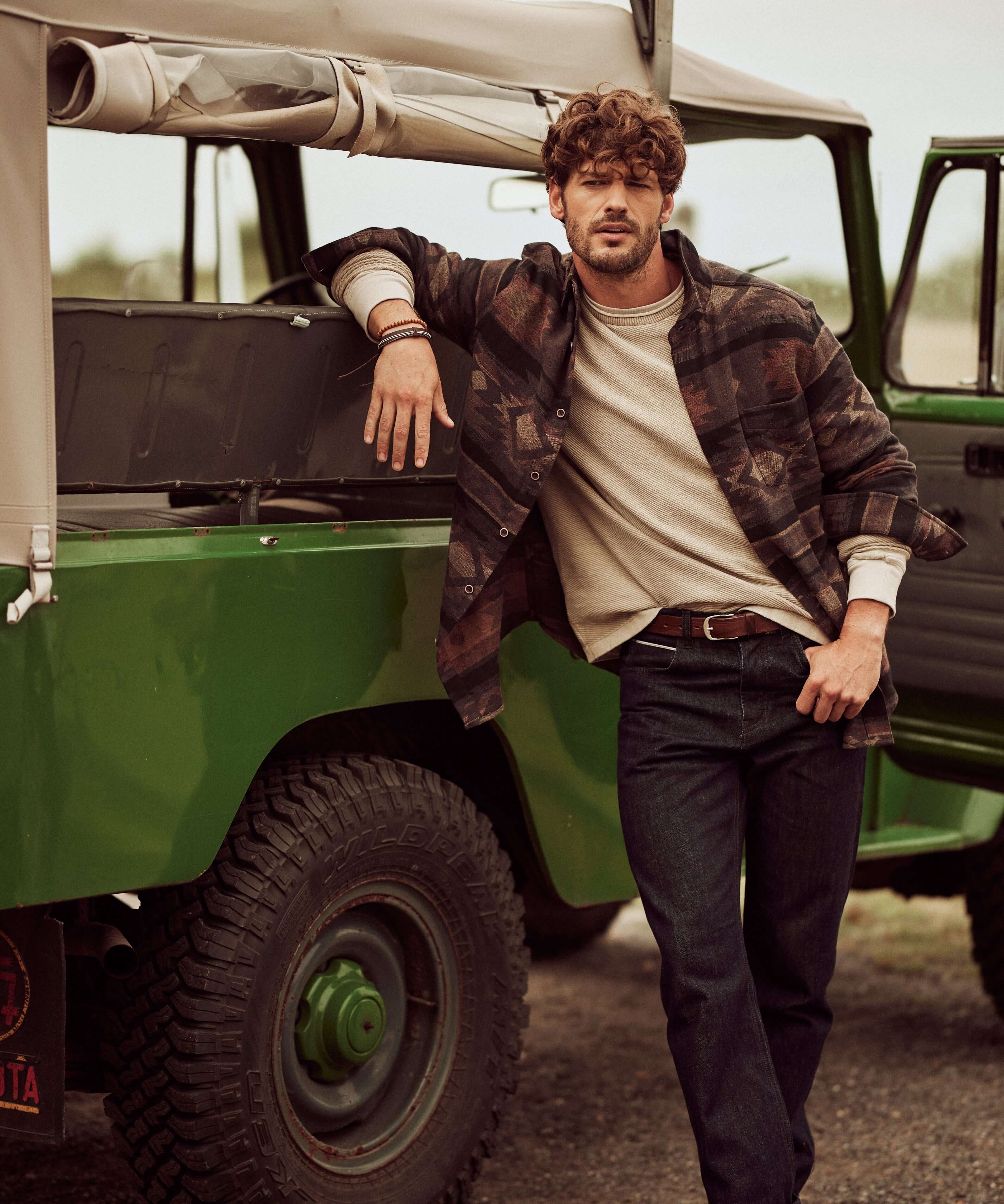 Southwest Unlined Jacquard Overshirt in Chocolate Torte worn by model next to green vintage vehicle.