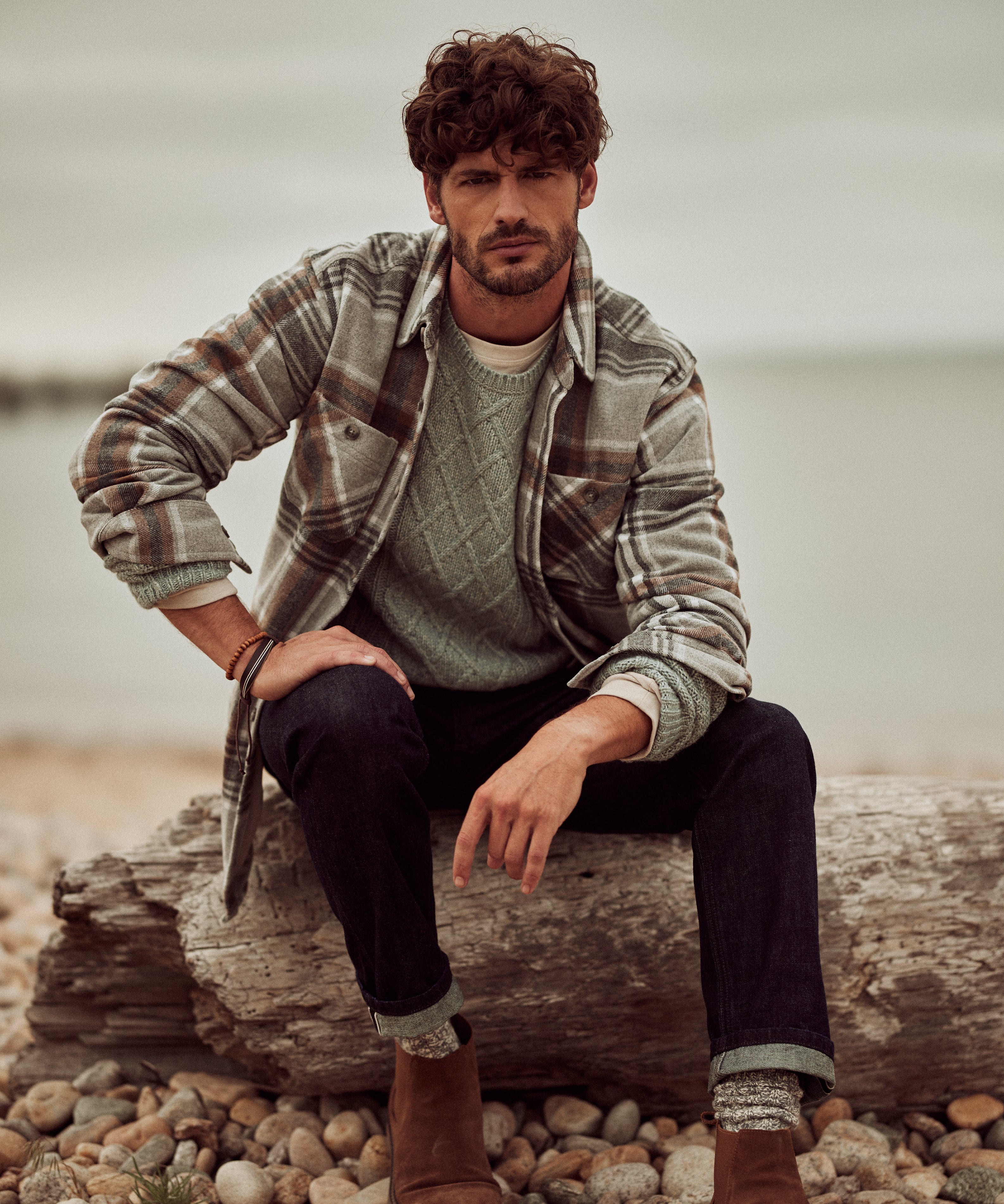 Wool Blend Plaid Shirt Jacket in Castor Grey worn by a man at the beach, showcasing its classic style and cozy fit.