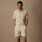 Model wearing a cream 6" corduroy cabana short and matching top, ideal for casual summer outings.