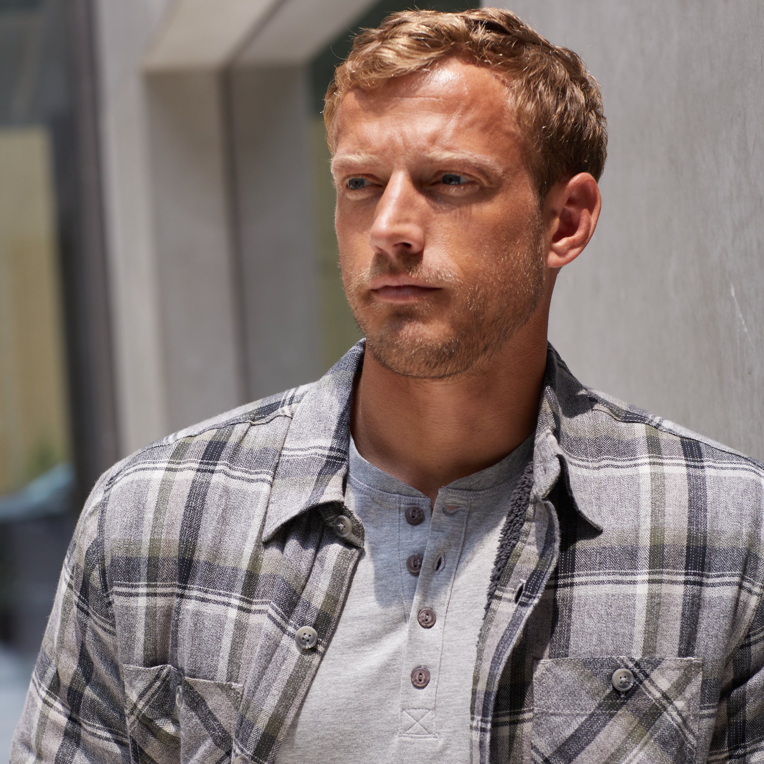 Man wearing a Sherpa Lined Flannel Shirt Jacket In Twine, showcasing a relaxed fit and classic design.