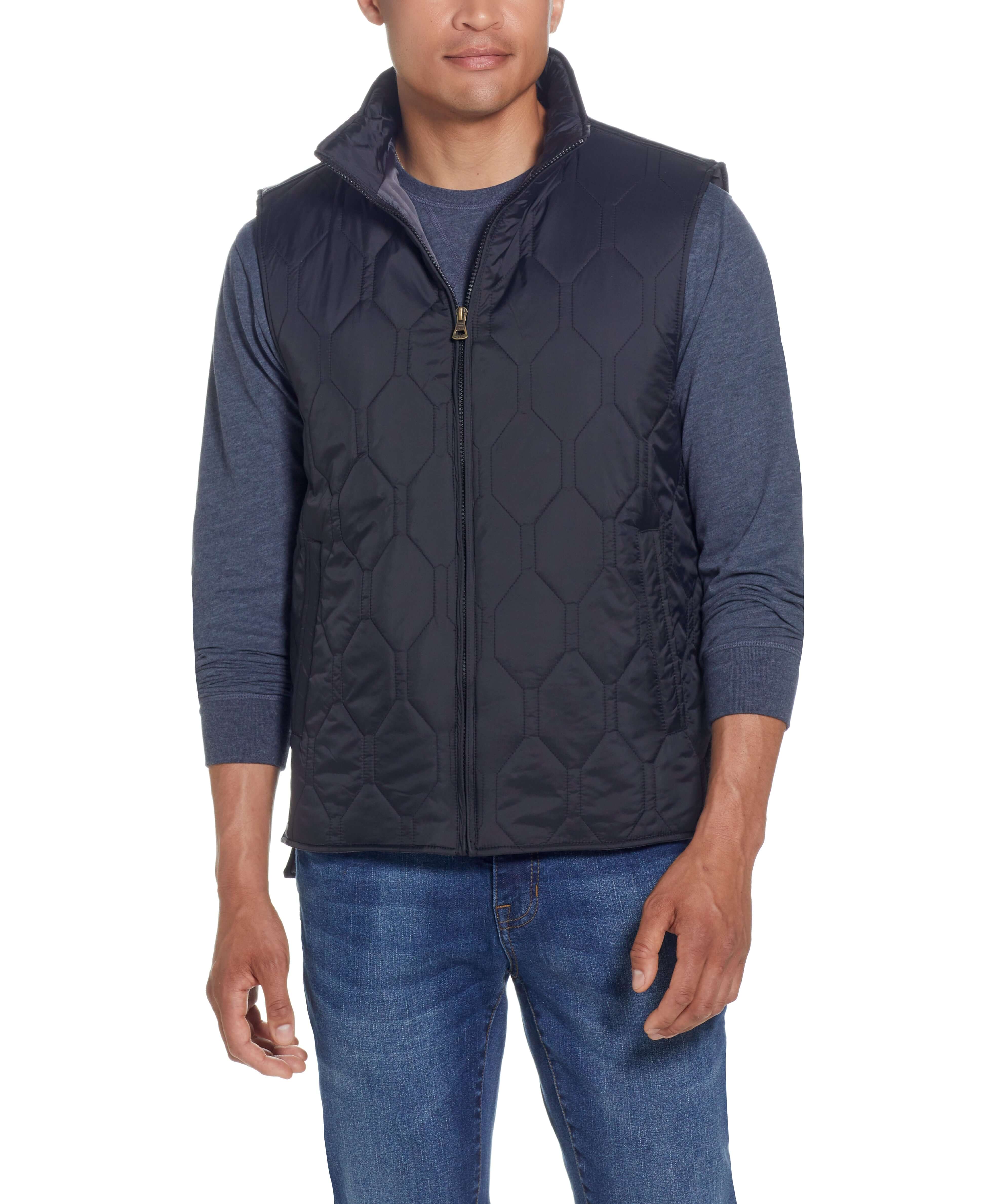 Hexagon Quilted Lightweight Vest In Black worn by a model, showcasing its classic cut and front-zip closure.