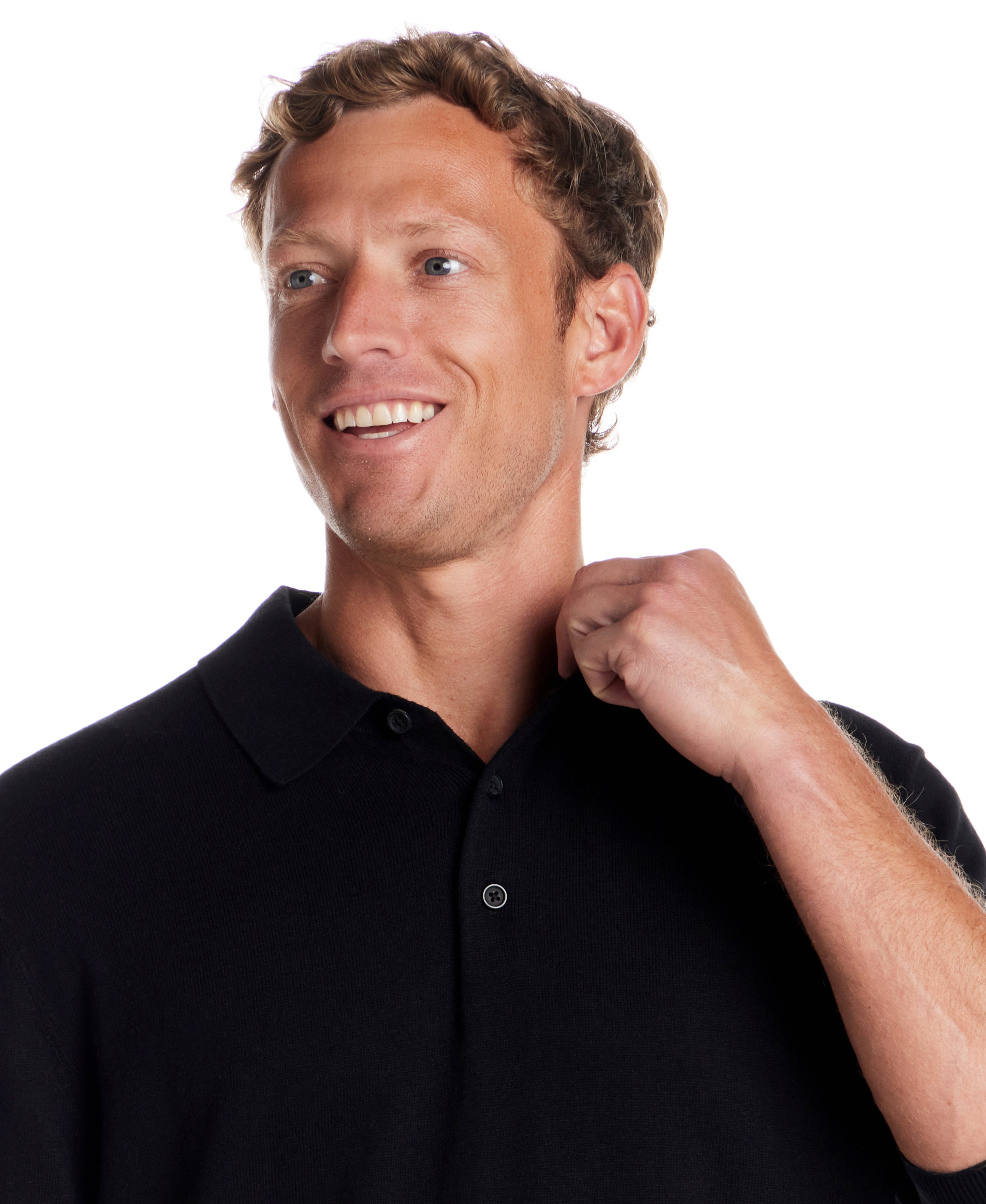 Cotton Cashmere Long Sleeve Polo in Black worn by a smiling model adjusting the collar.