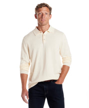 Cotton Cashmere Long Sleeve Polo in Ivory worn by a model, showcasing a refined and lightweight knit design.
