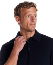 Cotton Cashmere Long Sleeve Polo in Navy on model with light background, showcasing the polo collar and long sleeves.