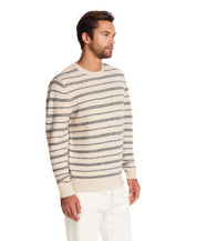 Fuzzy striped crew sweater in cream and blue, classic fit, perfect for cool weather. Model showcases casual nautical style.