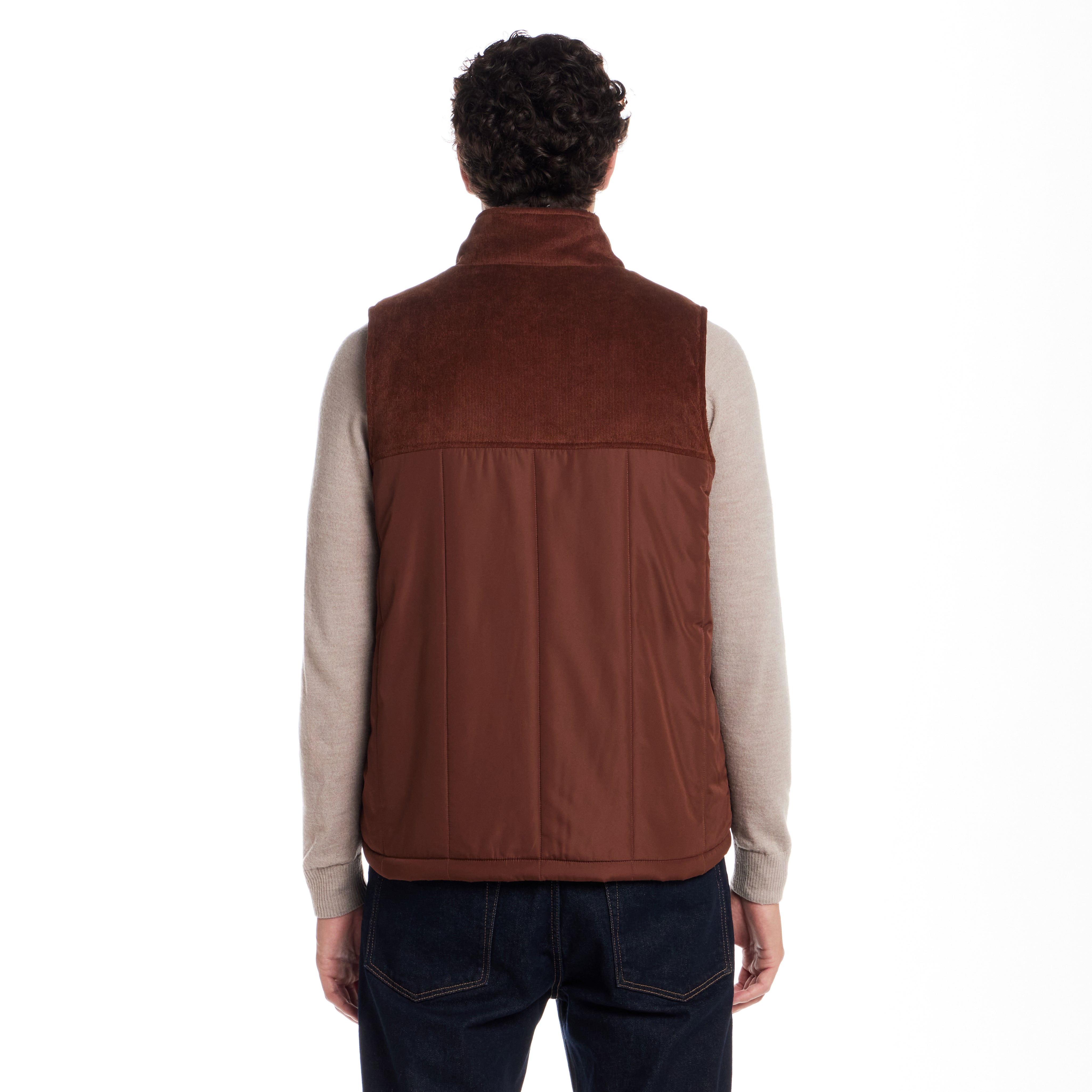 Back view of Sherpa Lined Mixed Media Puffer Vest in Cappuccino showcasing soft lining and corduroy details.