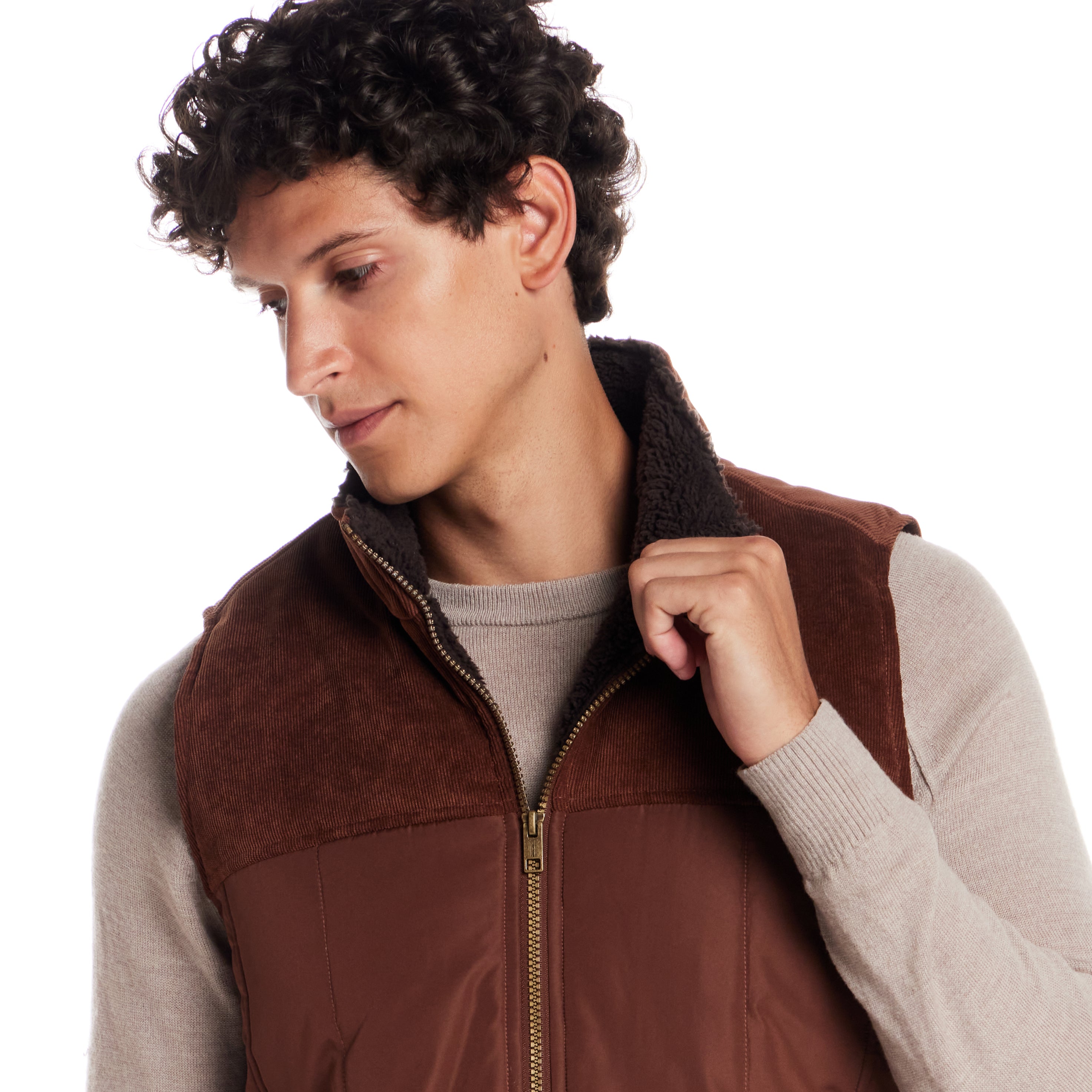 Sherpa Lined Mixed Media Puffer Vest in Cappuccino on a model with a vintage appeal and warm sherpa lining.