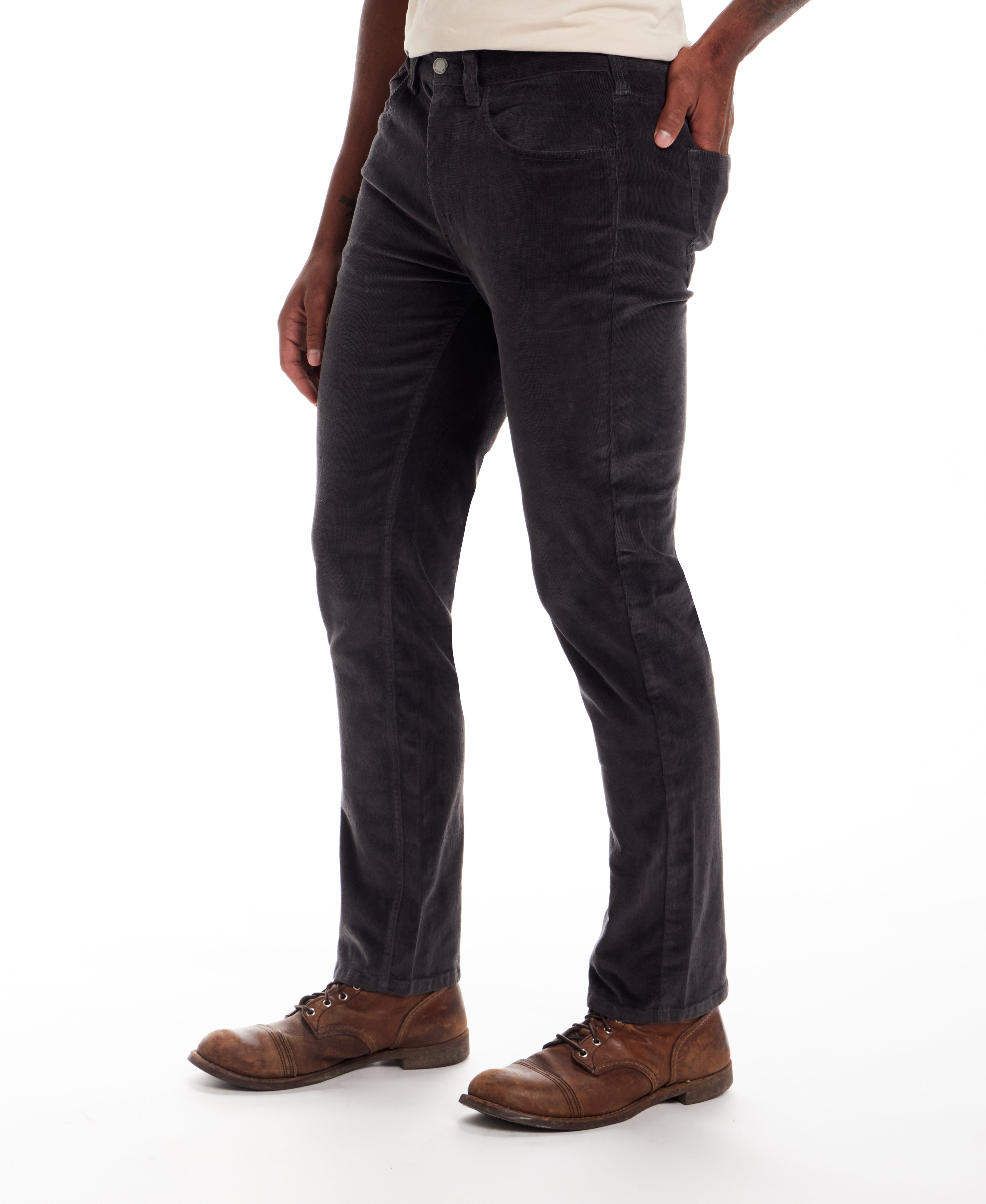Model wearing Superfine Cord Pants in Forged Iron, showcasing a straight-leg cut and fine wale texture.