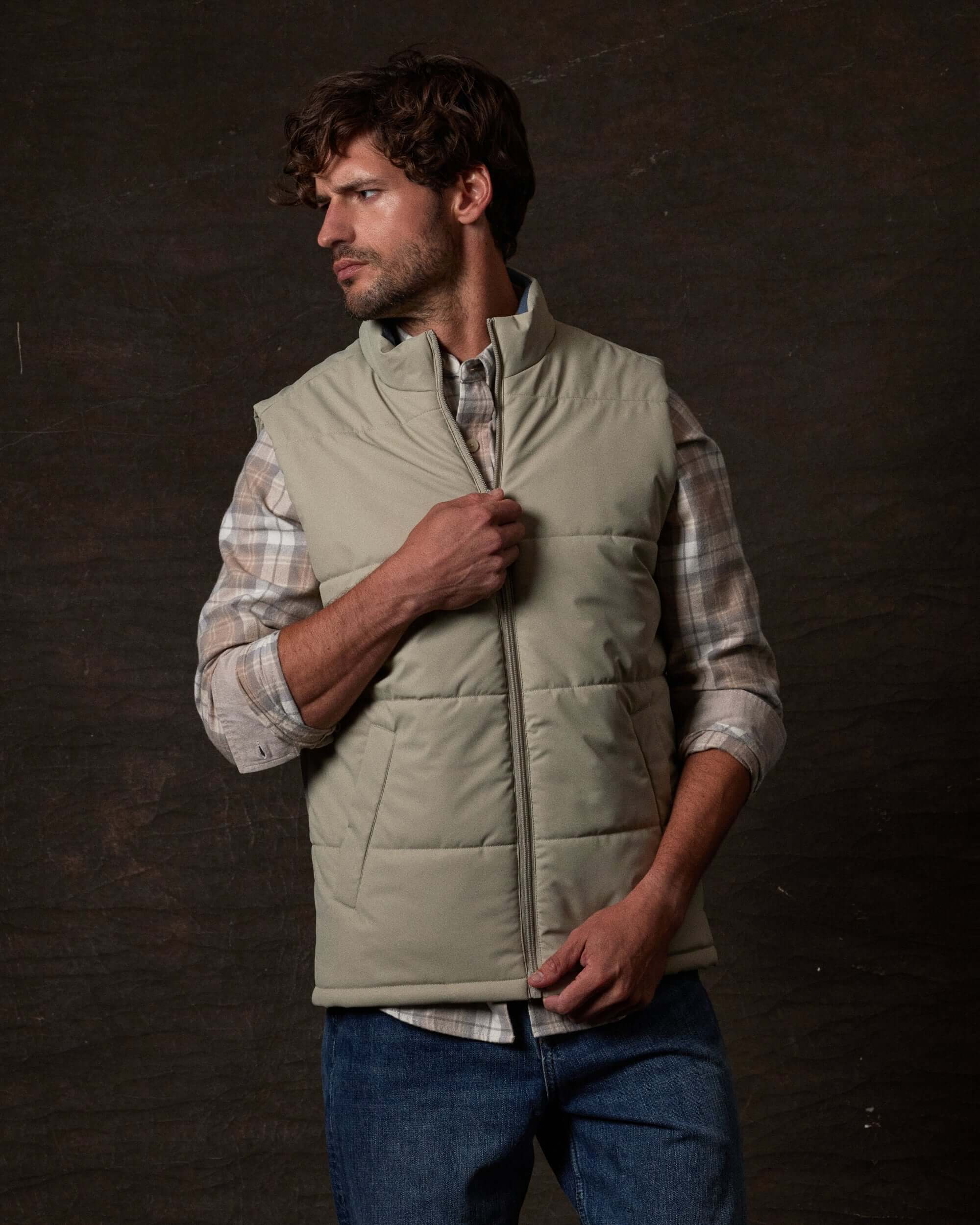 Matte Coated Shell Puffer Vest in Abbey Stone worn by model, showcasing its sleek design and modern utility.
