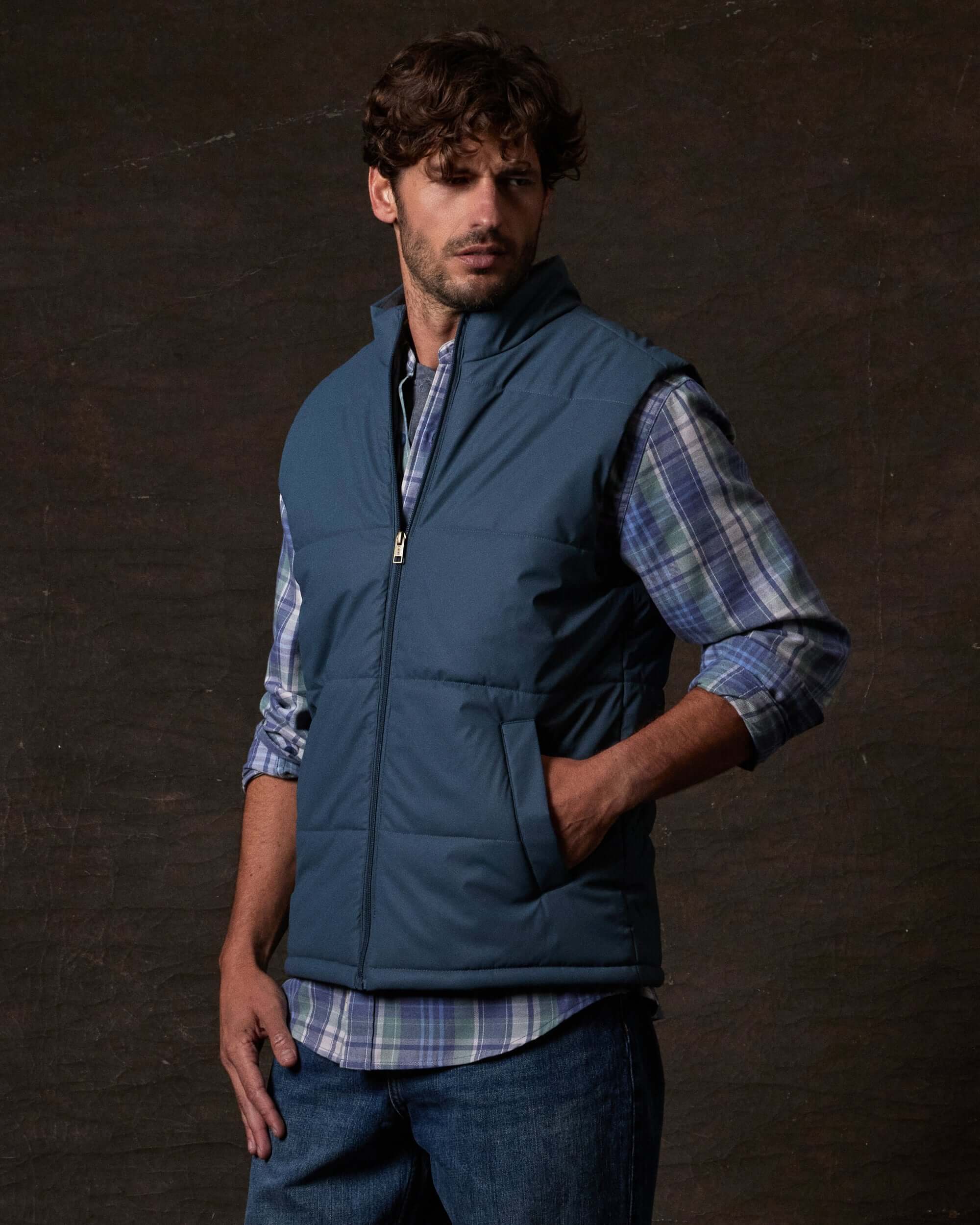 Matte Coated Shell Puffer Vest in Slate Blue worn by a model, showcasing rugged utility and classic fit.