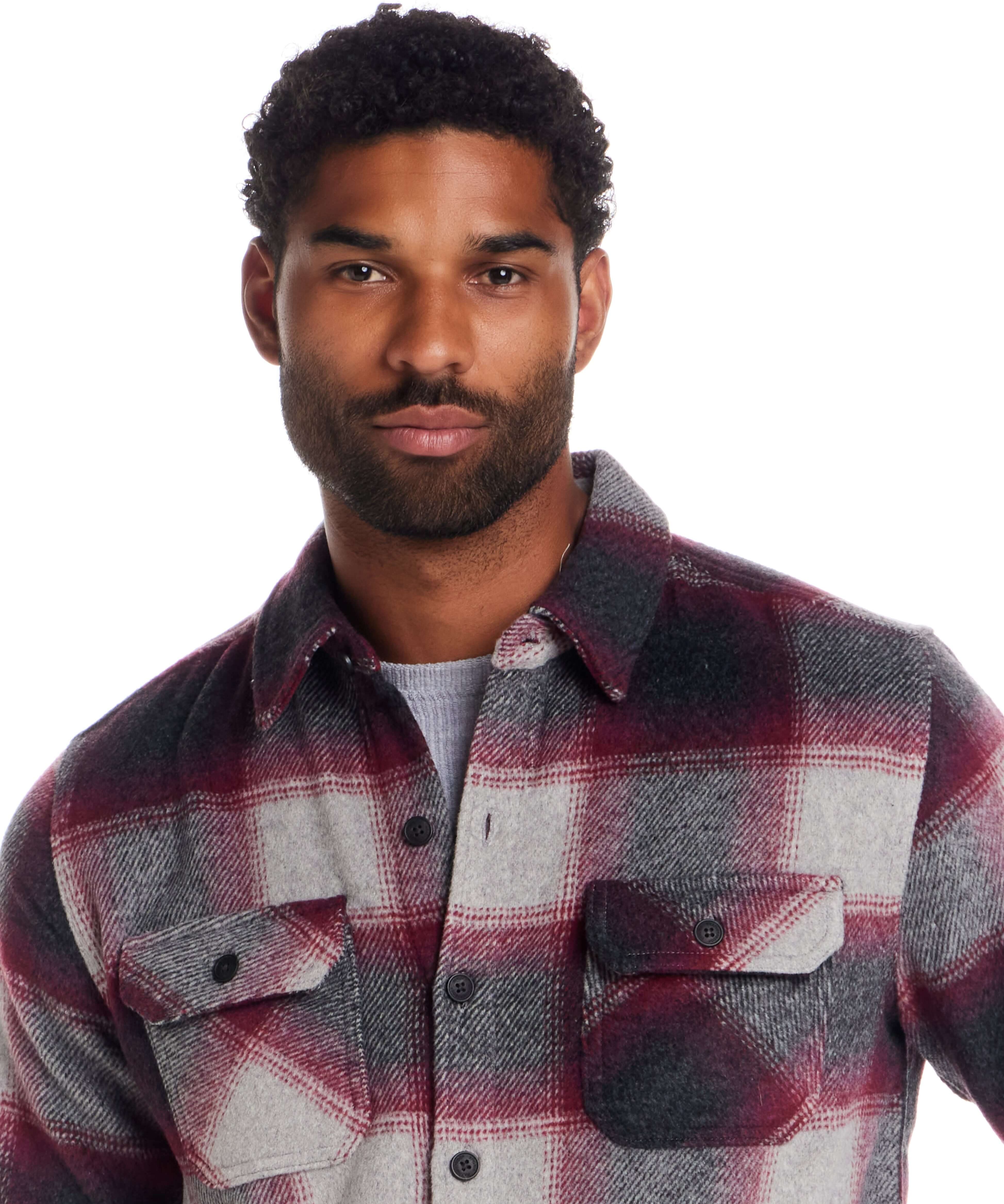 Model wearing a Brushed Unlined Shirt Jacket in Burgundy with plaid design and button front.