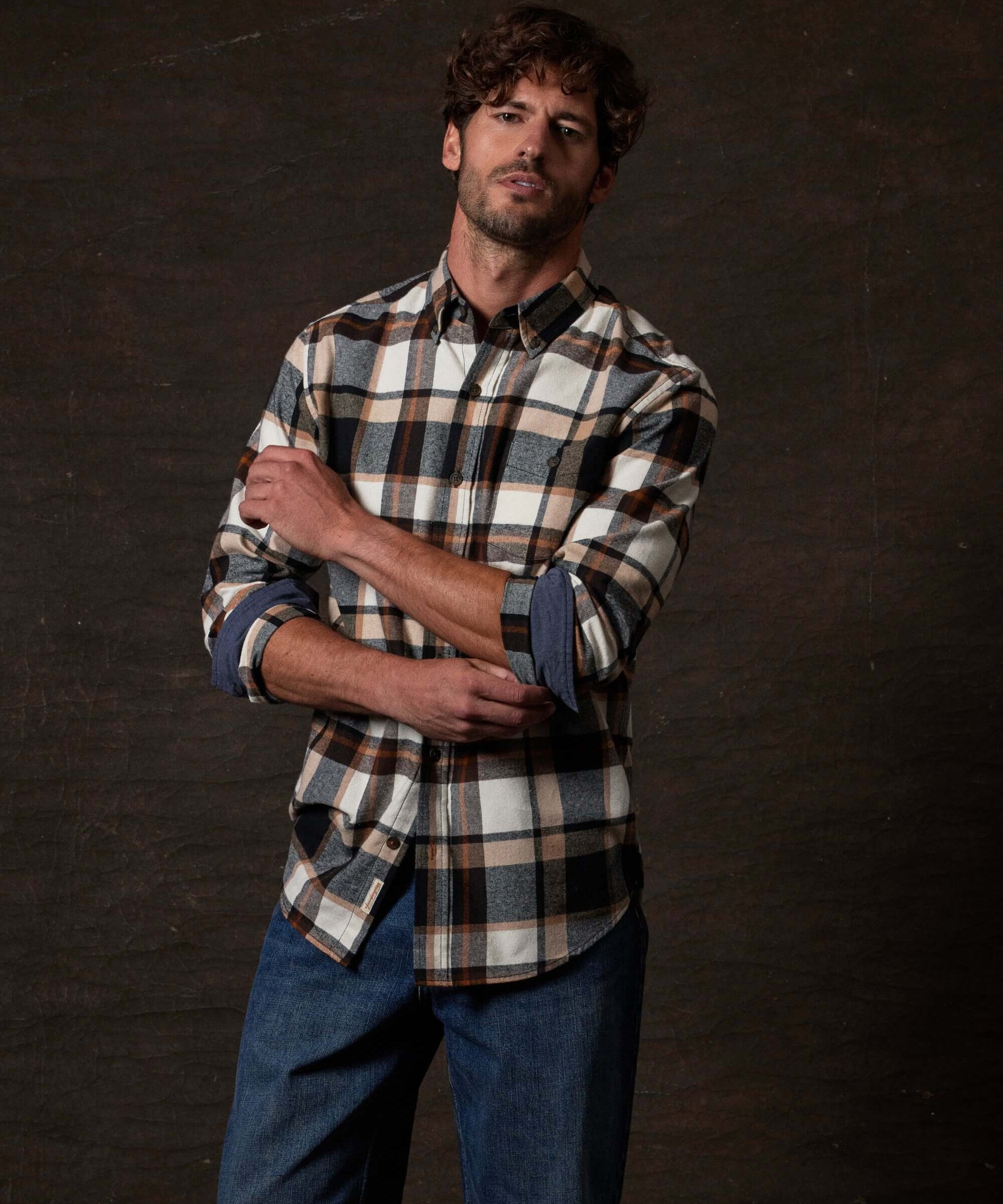 Long Sleeve Brushed Flannel in Caramel Cafe worn by a model, showcasing its rustic design and button-down features.