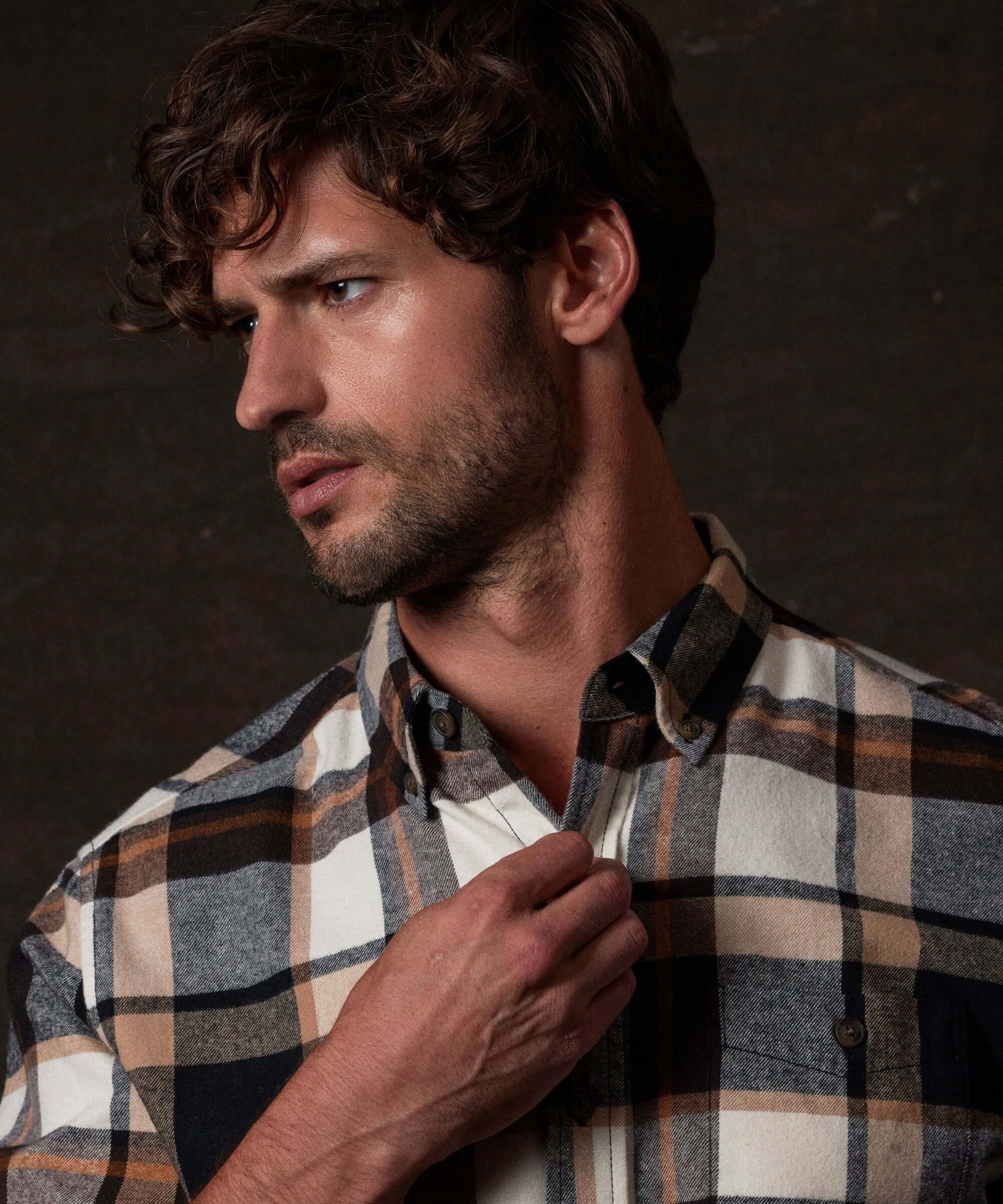 Long Sleeve Brushed Flannel in Caramel Cafe worn by a man, featuring a button-down collar and plaid pattern.