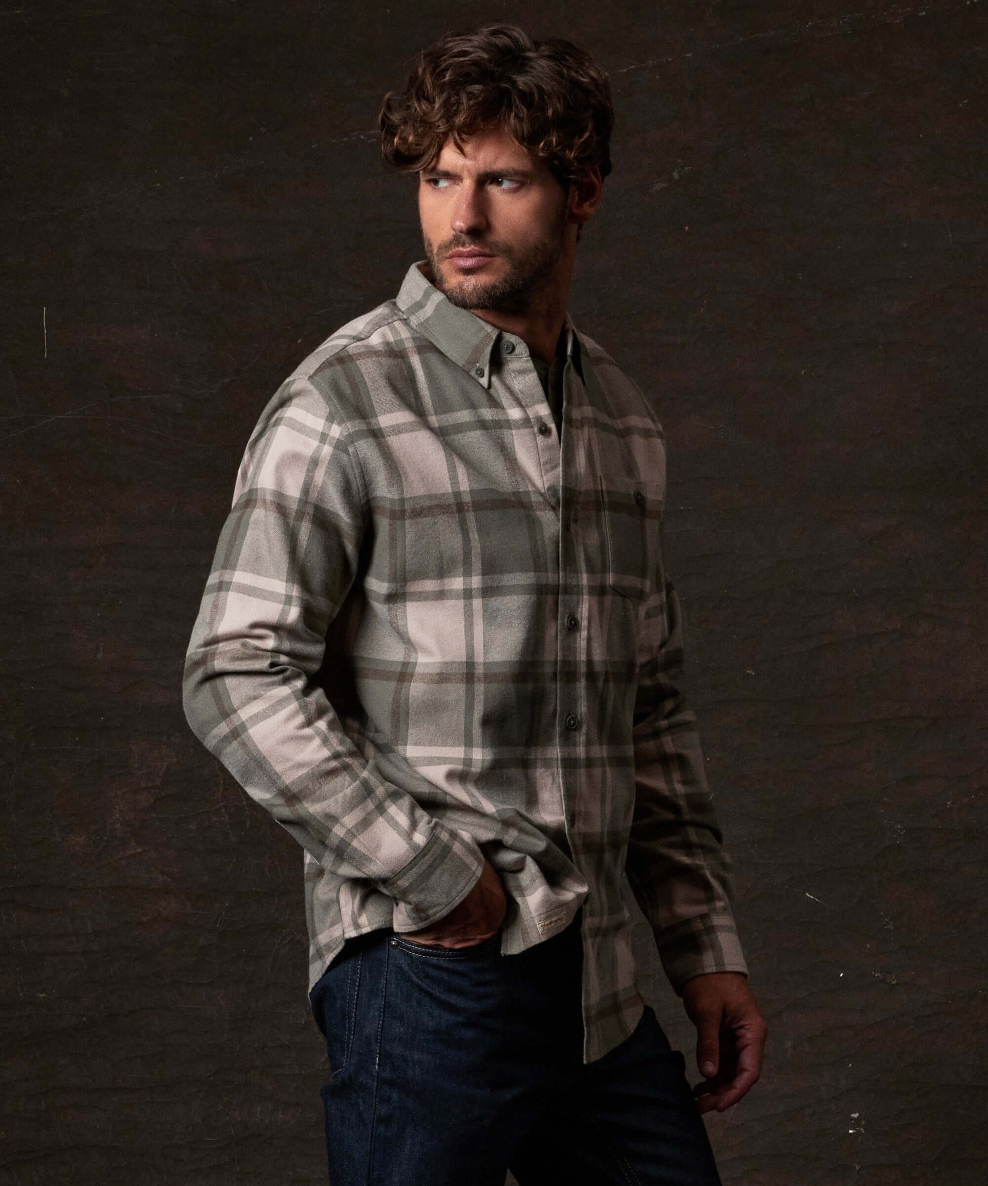 Model wearing Long Sleeve Brushed Flannel in Kalamata with a button-down collar and buttoned breast pocket.