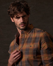 Long Sleeve Brushed Flannel in Pumpkin Spice worn by a model, showcasing its rugged vintage style and soft fabric.