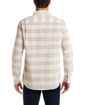 Back view of a model wearing a Long Sleeve Plaid Cord Shirt in Natural, showcasing its stylish plaid design.