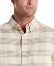 Close-up of model wearing Long Sleeve Plaid Cord Shirt in Natural with button-down collar and chest pocket.