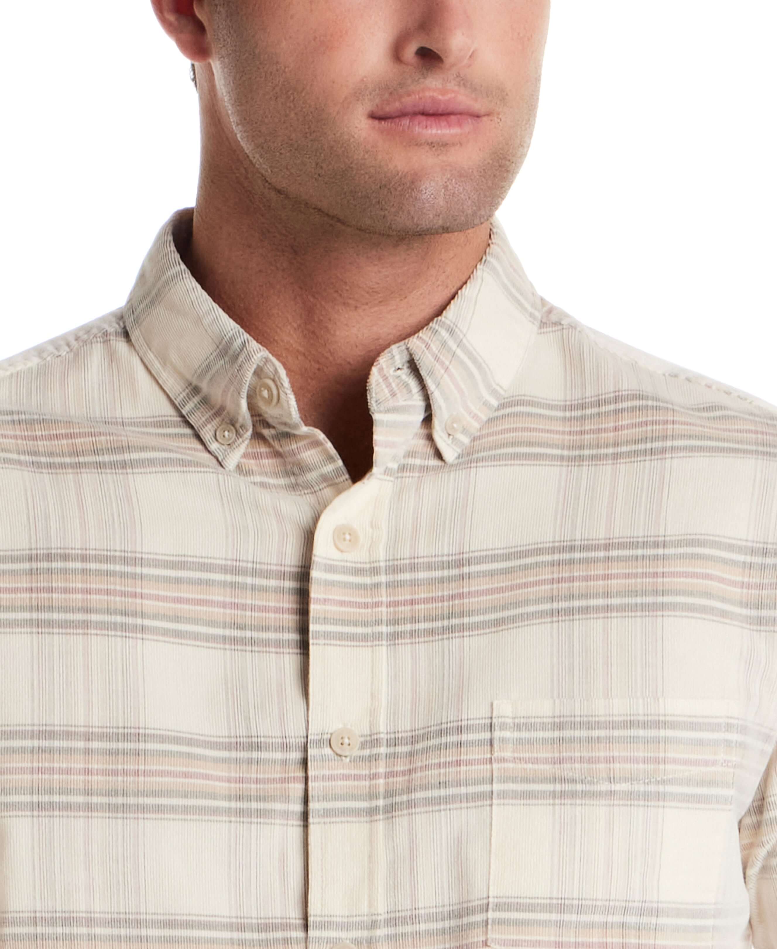 Close-up of model wearing Long Sleeve Plaid Cord Shirt in Natural with button-down collar and chest pocket.