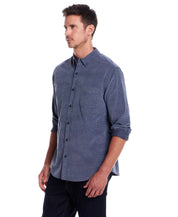 Long Sleeve Pebble Corduroy Shirt in Ensign Blue worn by a model, showcasing button-down collar and cuffed sleeves.