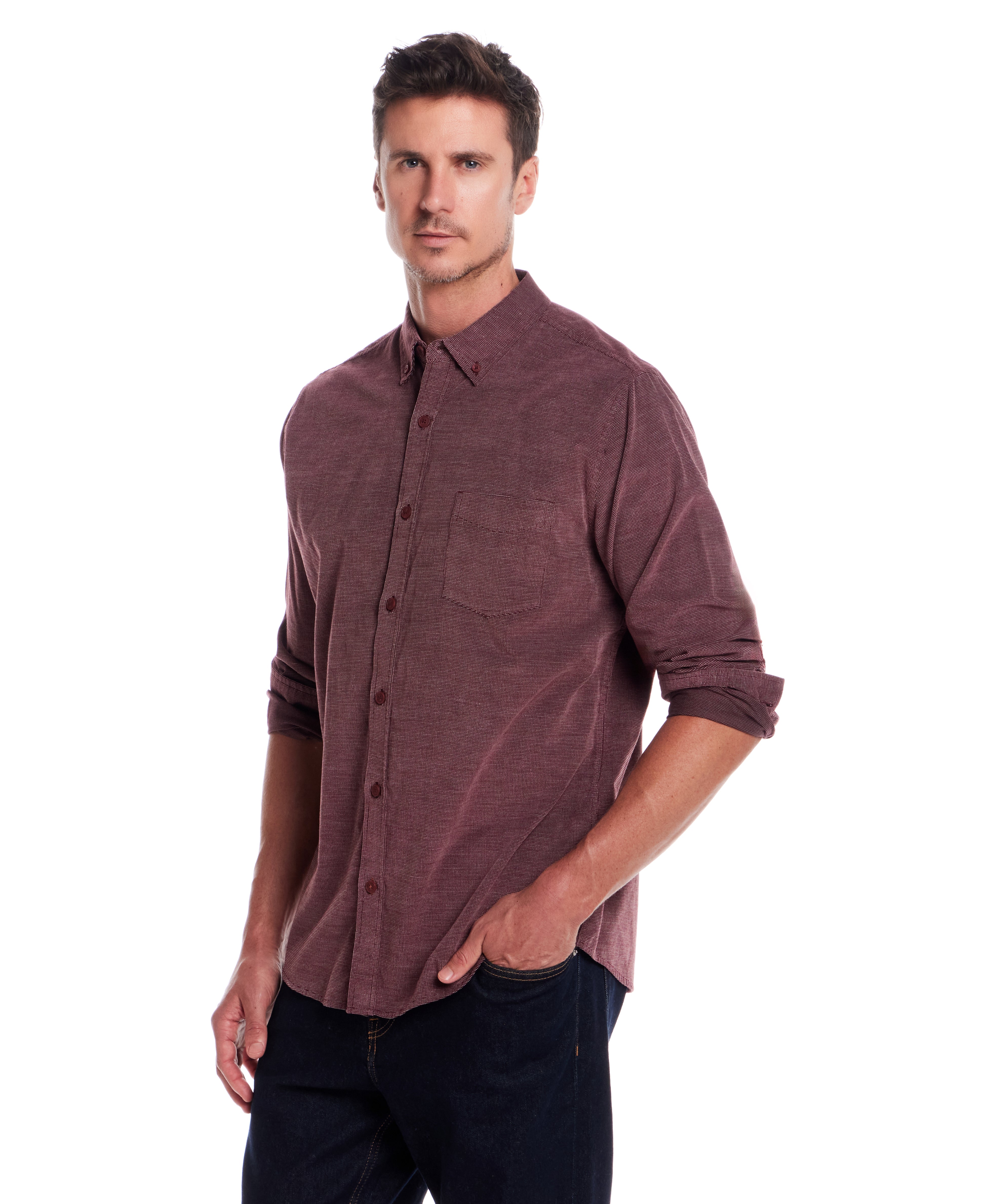 Long Sleeve Pebble Corduroy Shirt in Syrah worn by a model, showcasing its button-down collar and cuffed sleeves.