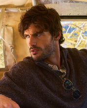 Fuzzy Quarter Zip Sweater in Brown worn by a man sitting inside a vintage vehicle.