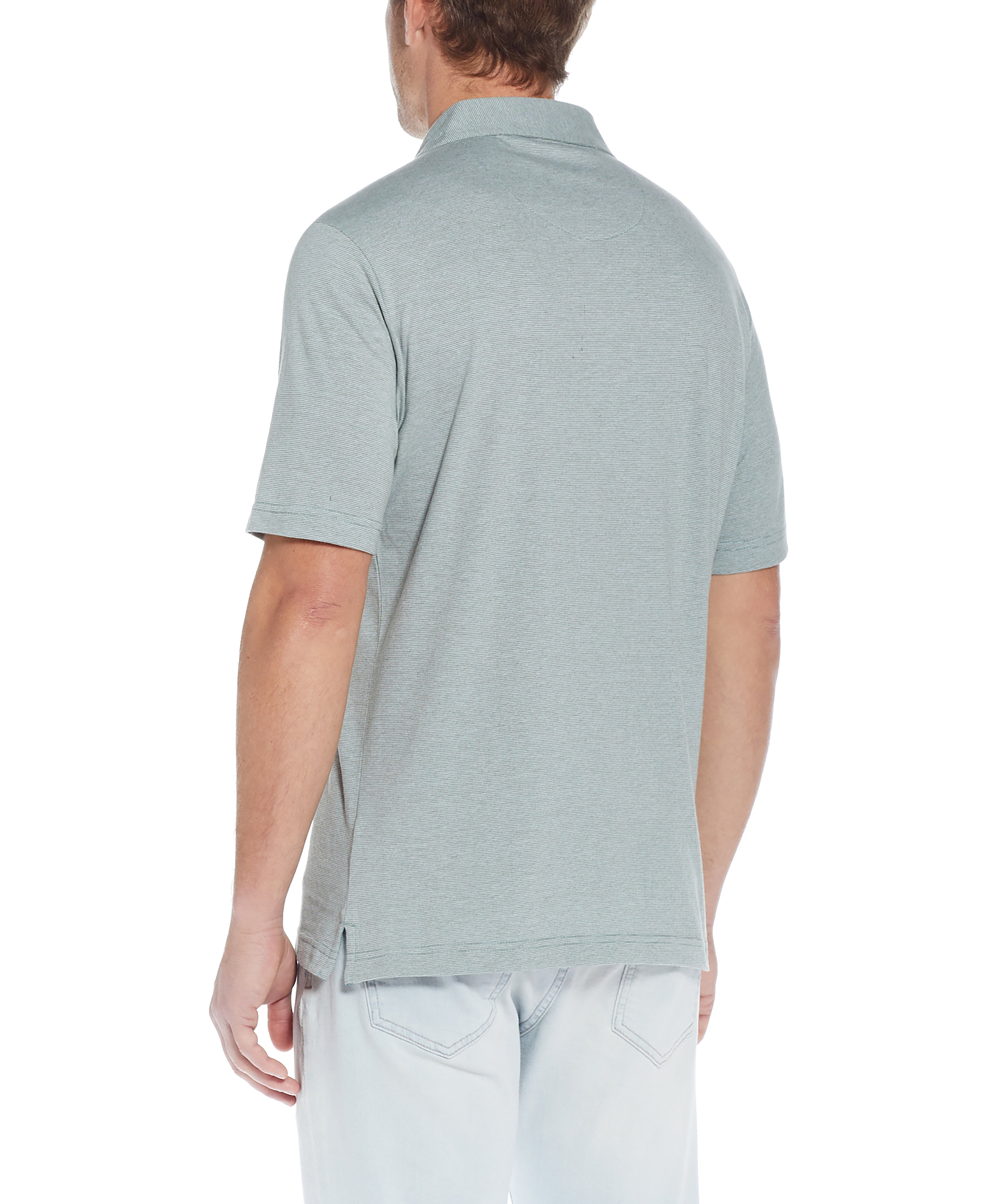 Back view of a man wearing the Mini Stripe Polo In Four Leaf Clover, showcasing the soft jersey fabric.