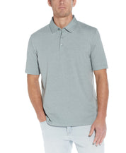 Mini Stripe Polo In Four Leaf Clover modeled by a man, showcasing its casual yet stylish design.