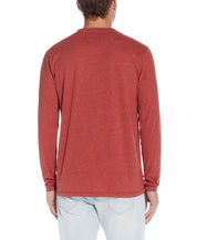 Back view of Long Sleeve Henley In Red Ochre, showcasing its soft texture and smooth fit.