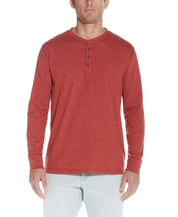 Long Sleeve Henley In Red Ochre worn by a model, showcasing its soft fabric and classic design.
