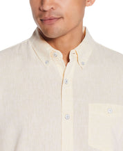 Short Sleeve Solid Linen Cotton In Cornsilk worn by a model with a soft yellow hue and button-down collar, showcasing comfort.