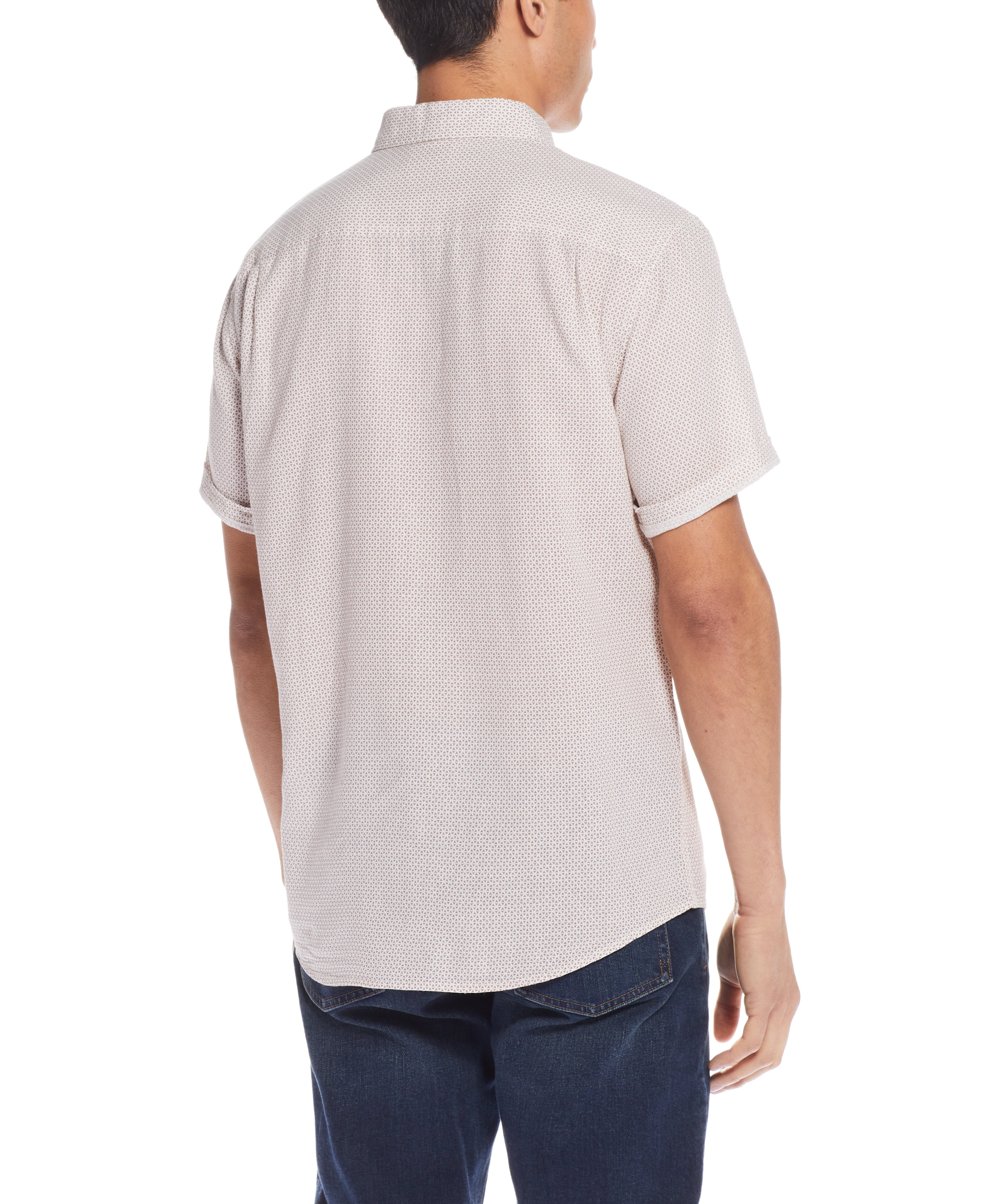 Back view of a man wearing a Mini Geo Print Shirt In Cinnamon Stick with short sleeves and relaxed fit.