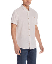 Mini Geo Print Shirt In Cinnamon Stick modeled by a man with a relaxed fit in a light abstract design.
