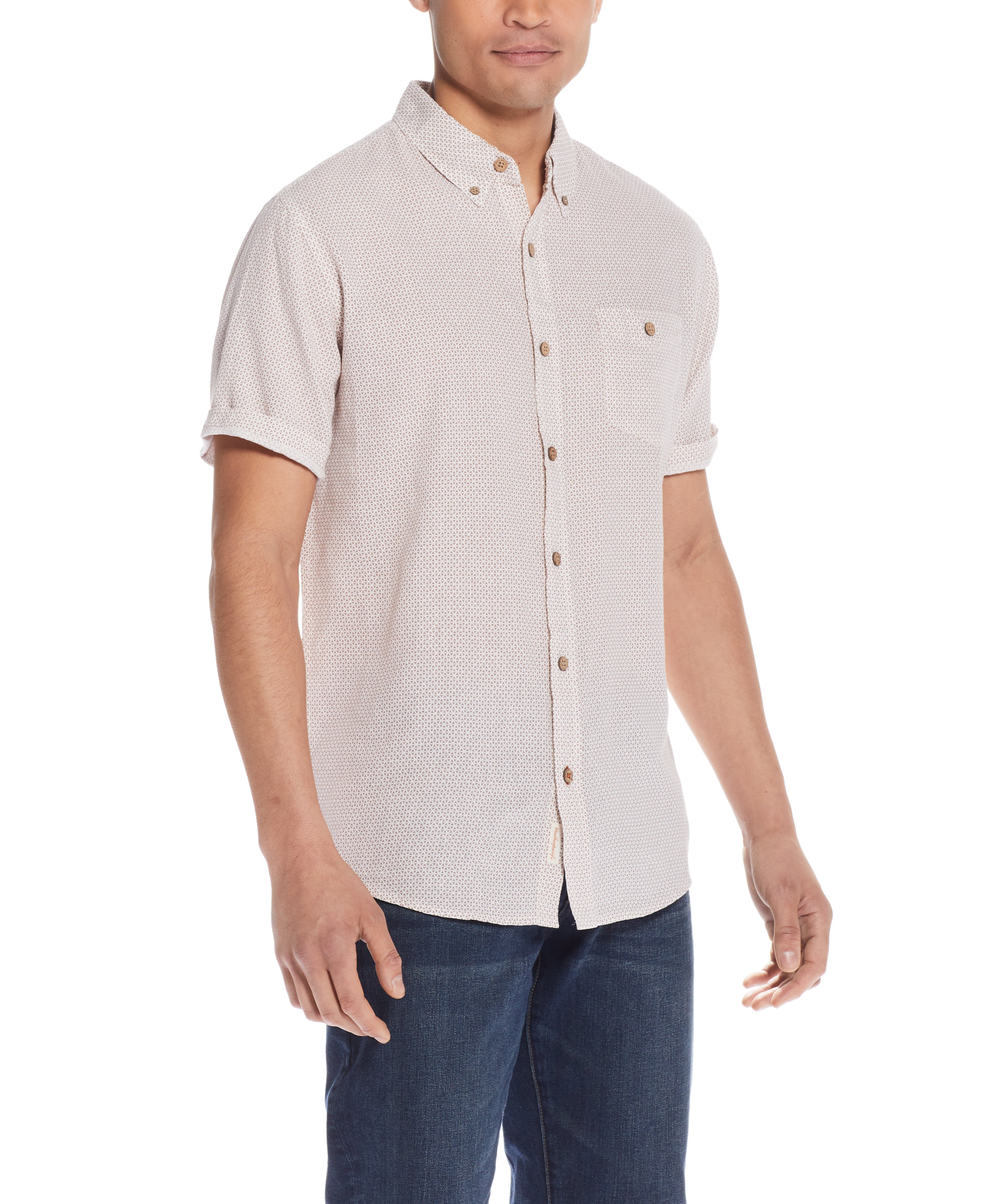 Mini Geo Print Shirt In Cinnamon Stick modeled by a man with a relaxed fit in a light abstract design.