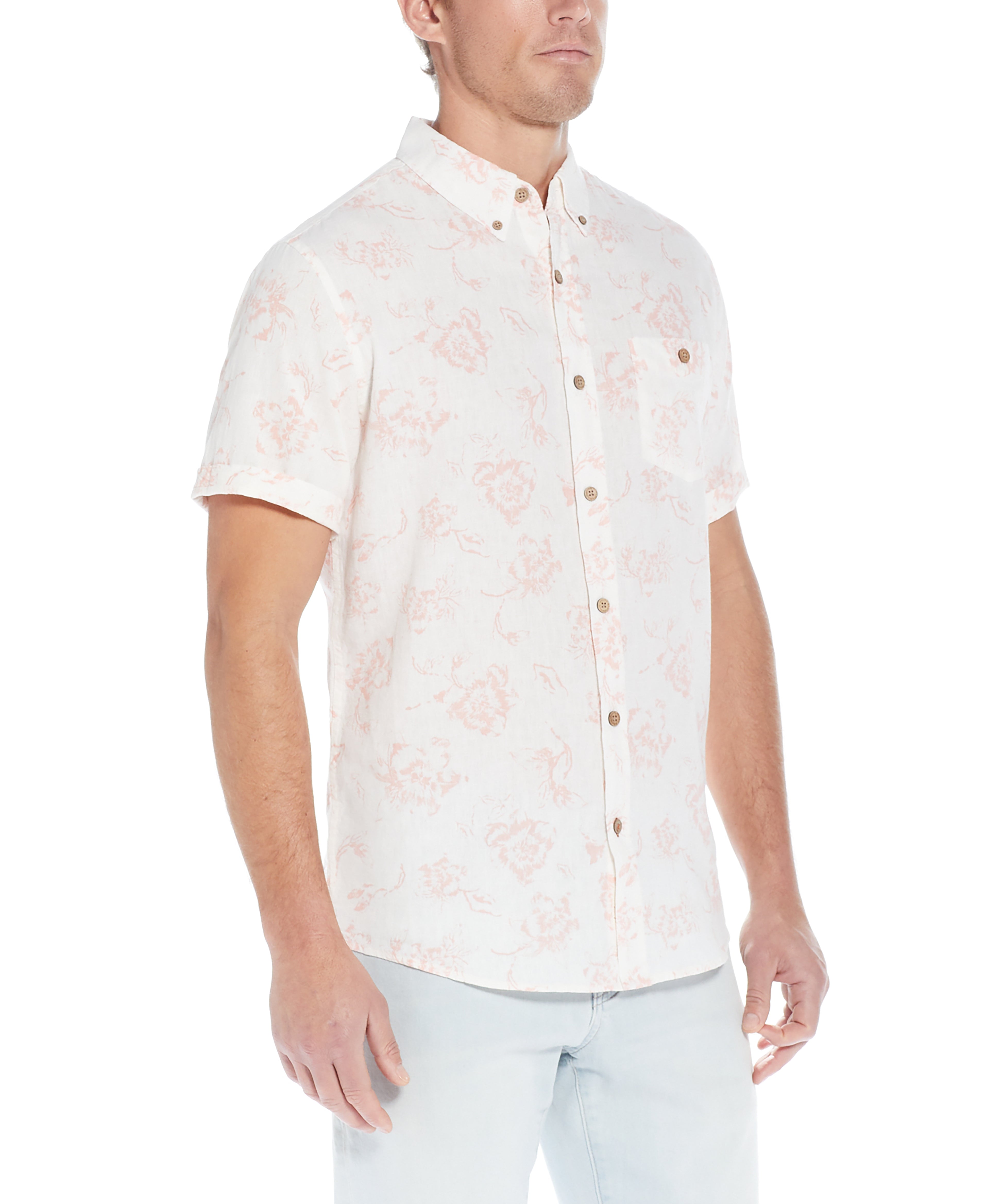 Floral Printed Shirt In Dusted Clay worn by model, showcasing relaxed fit and breezy linen cotton fabric.