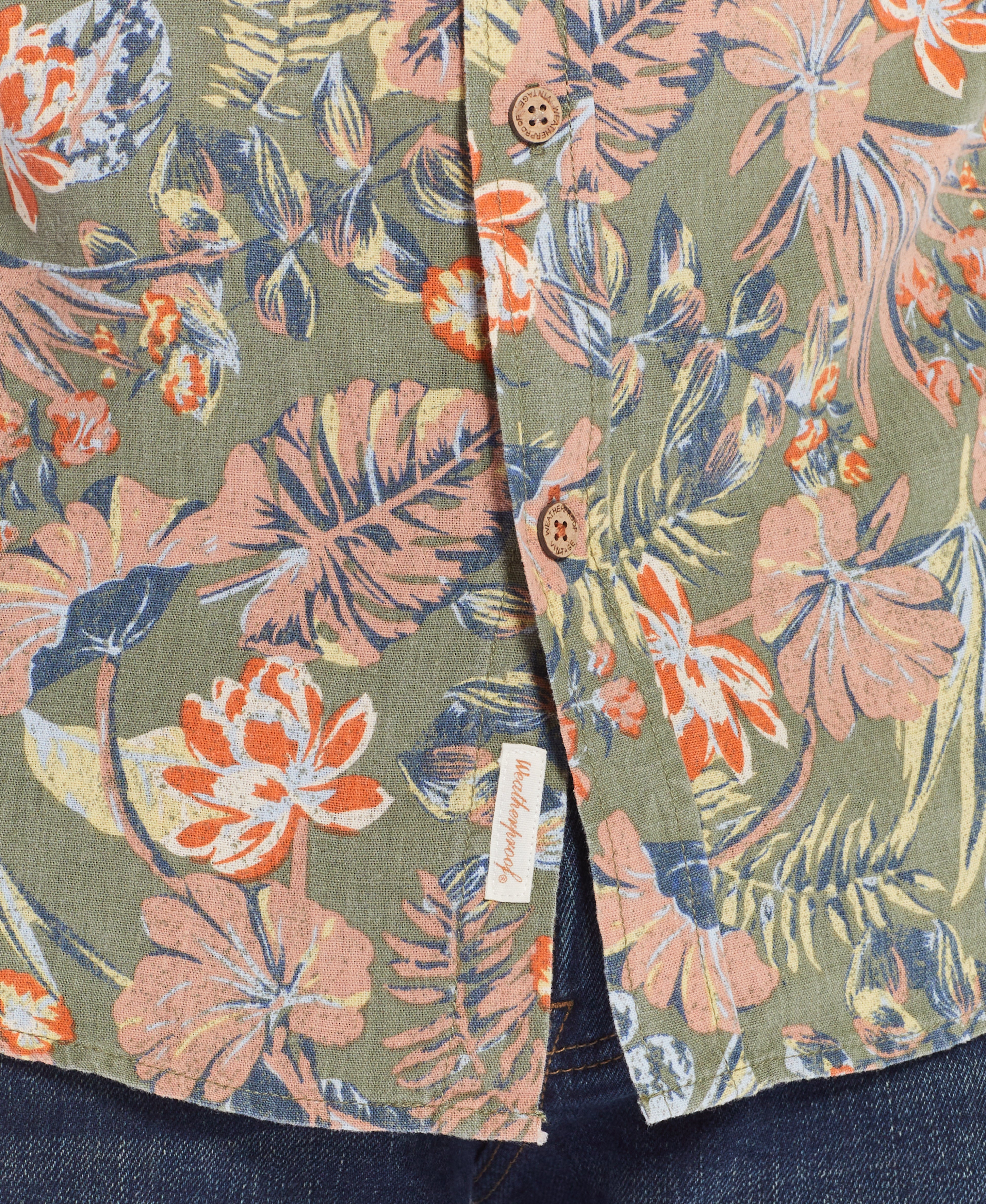 Floral Printed Shirt In Dusty Olive showcasing vibrant floral print and relaxed fit button-down design.