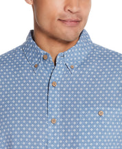 Model showcasing the Mini Print Shirt In Riverside Floral, featuring a button-down design and relaxed fit.