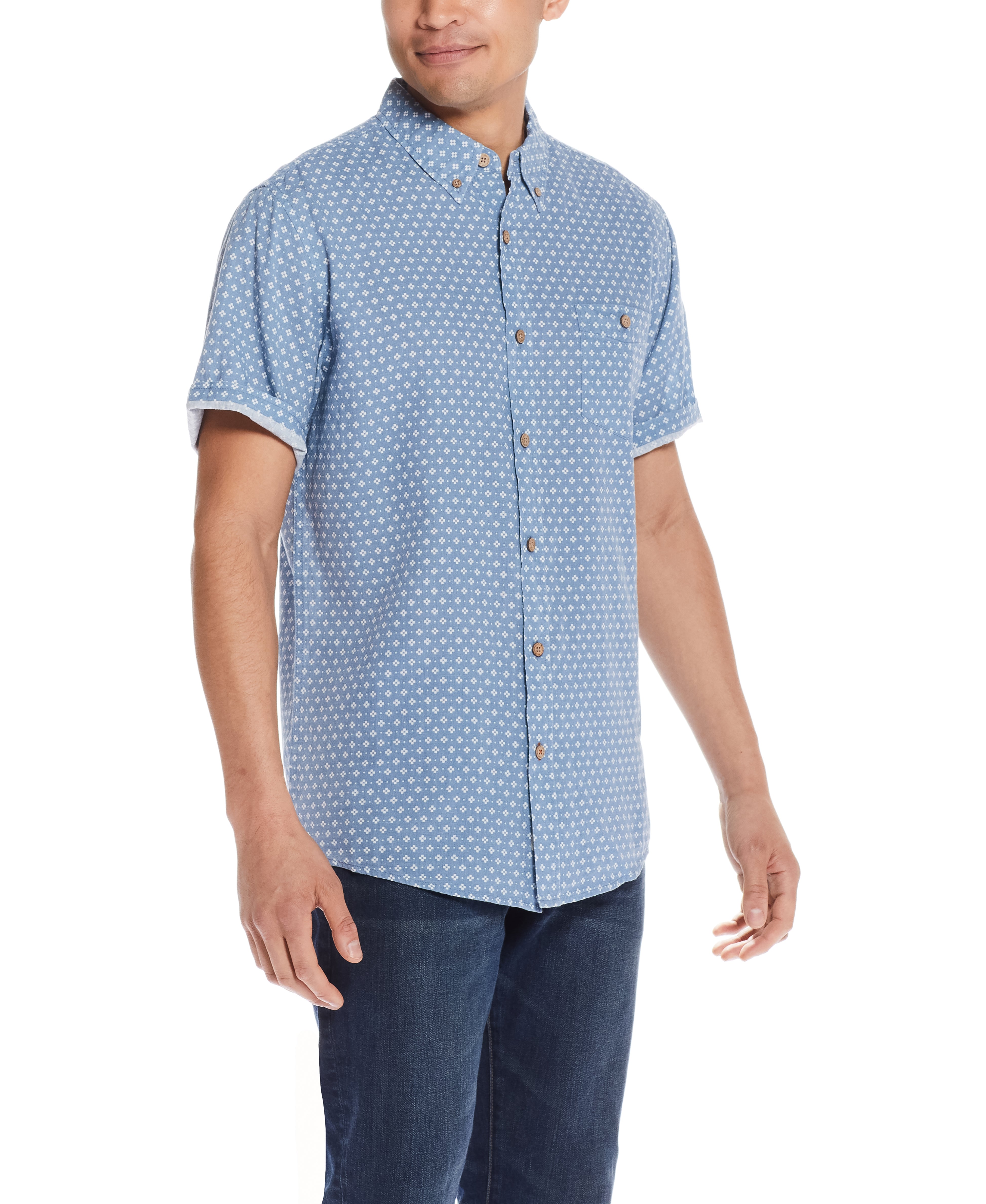 Model wearing the Mini Print Shirt In Riverside Floral, showcasing a relaxed fit, short sleeves, and a fun floral print.