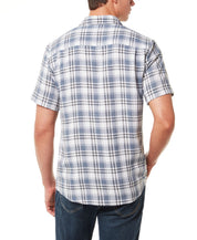 Back view of a man wearing a Plaid Performance Shirt In White with short sleeves.