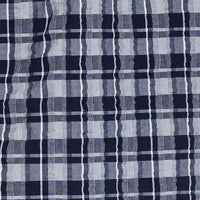 Plaid Seersucker Shirt In Shadow fabric close-up with navy and gray stripes showcasing a textured design.