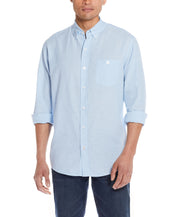 Long Sleeve Linen Cotton Shirt In Cerulean displayed on a model with rolled-up sleeves and front button closure.