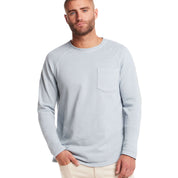 Men's long sleeve raglan sweatshirt in dusty blue, featuring a classic crew neck and chest pocket for comfort.