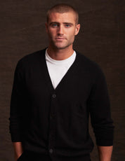 Man wearing a stylish black cashmere cardigan, perfect for layering in autumn and winter.