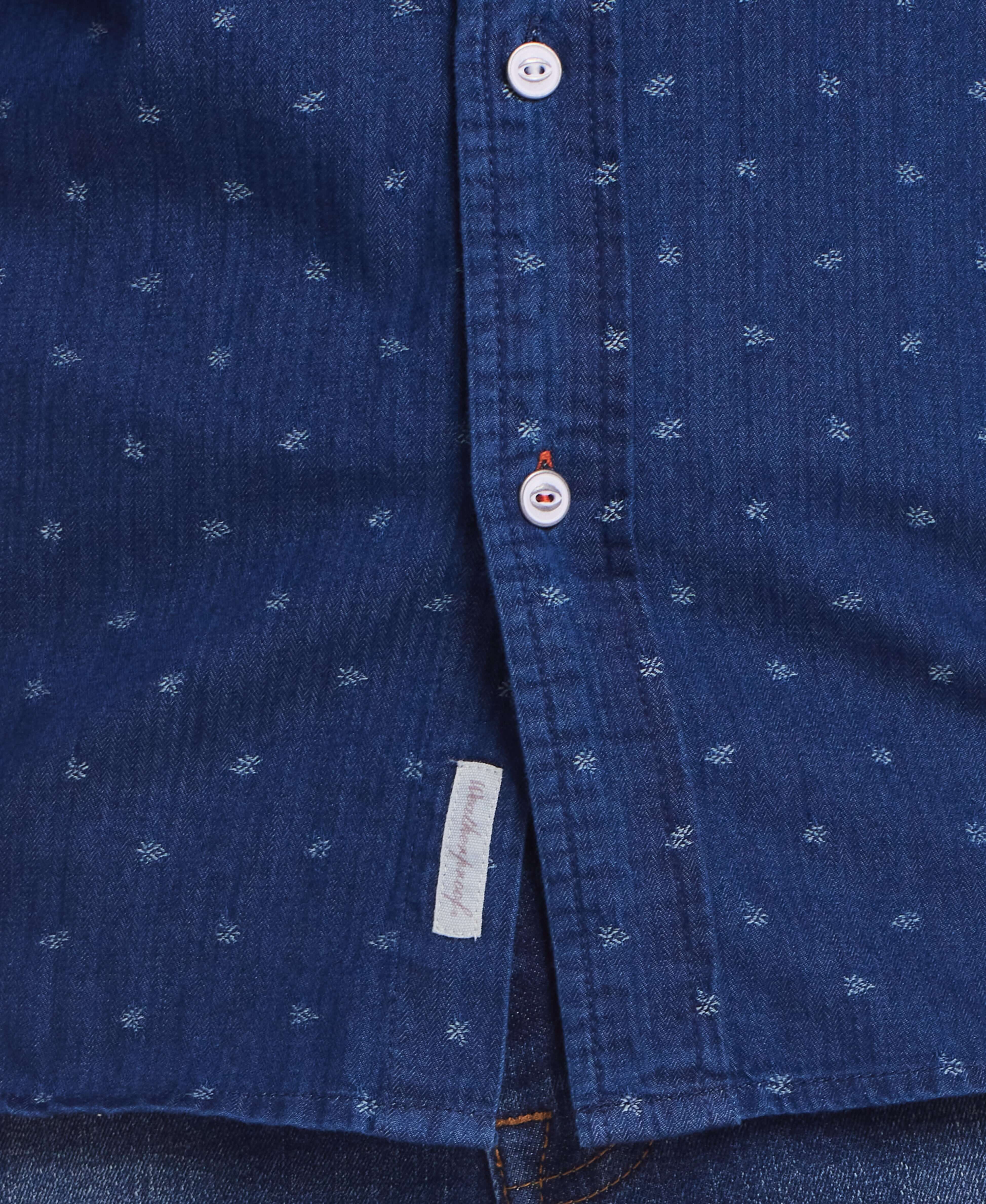Blue nights denim dobby shirt featuring button closure and floral print detail from Weatherproof Vintage.