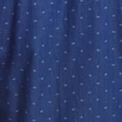 Close-up of a denim dobby fabric in blue nights showcasing a subtle floral print pattern.