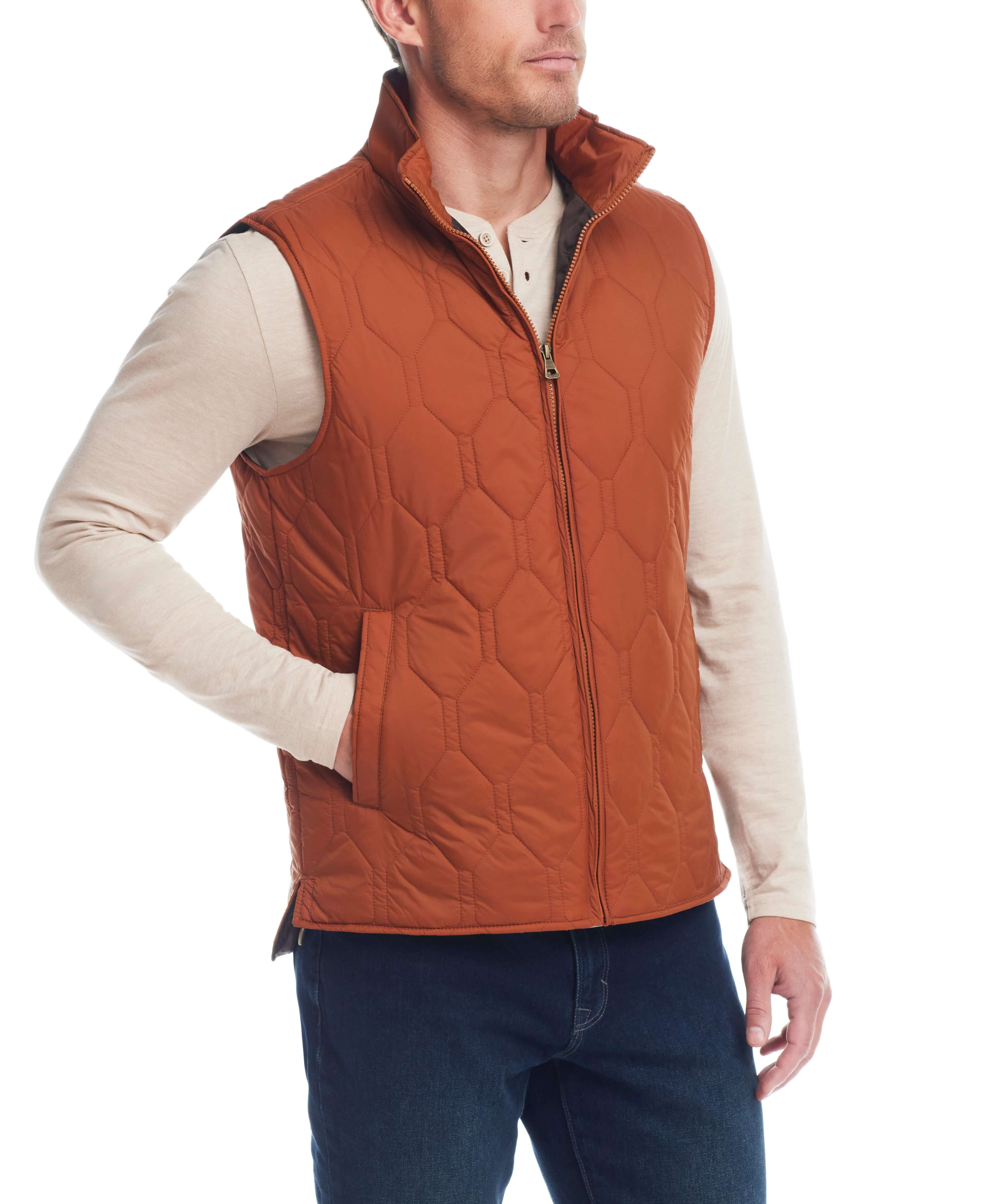 Man wearing a hexagon quilted lightweight vest in caramel cafe, featuring a front zipper and mock neck.