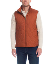 Hexagon quilted lightweight vest in caramel cafe, showcasing front zipper, mock neck, and side pockets, worn by male model.