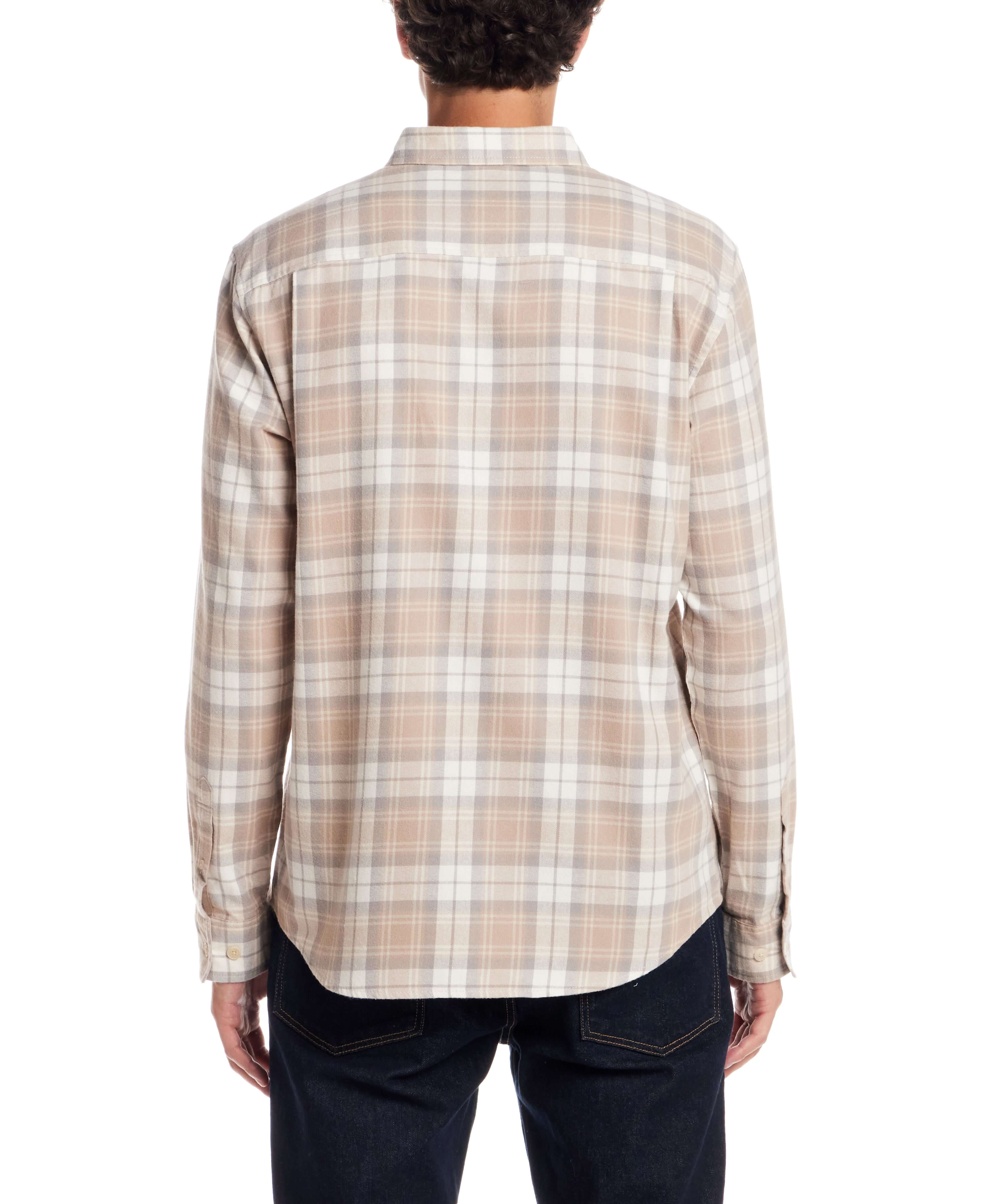 Back view of a model wearing a Long Sleeve Brushed Flannel in Beige, showcasing its classic plaid design.
