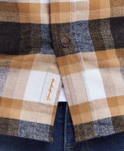 Close-up of a classic long sleeve brushed flannel shirt in antelope plaid, featuring a button-down collar and pocket.