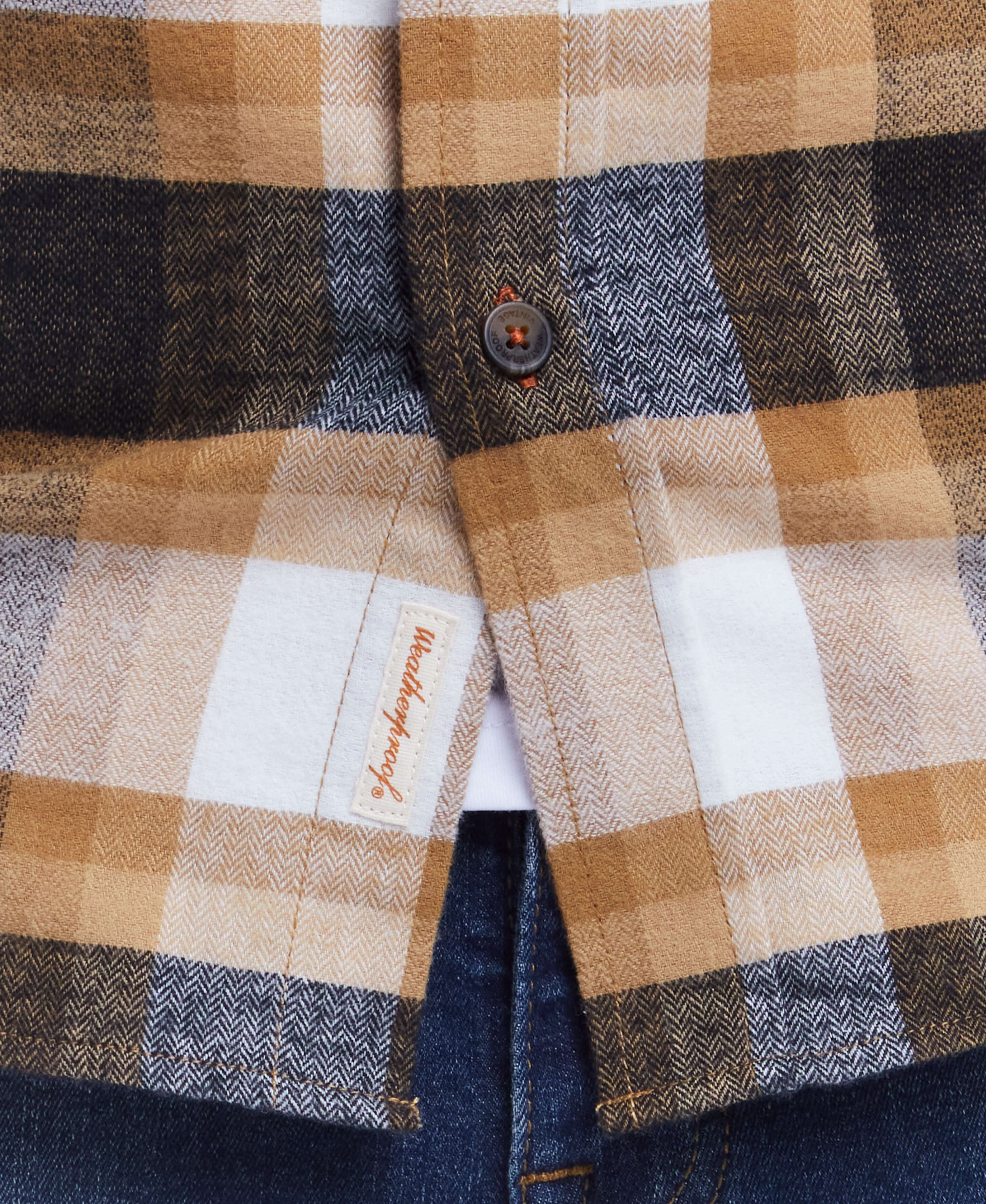 Close-up of a classic long sleeve brushed flannel shirt in antelope plaid, featuring a button-down collar and pocket.