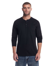 Stylish model wearing a long sleeve brushed jersey henley in black, perfect for year-round layering.